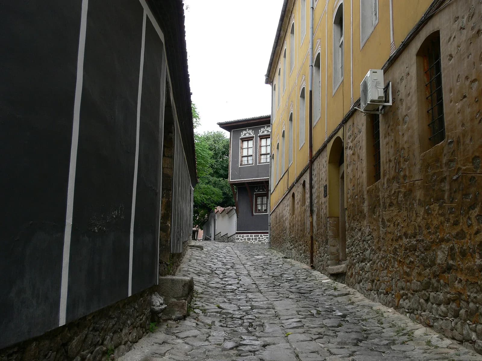 A cobbled lane between traditional buildings in Plovdiv Old Town