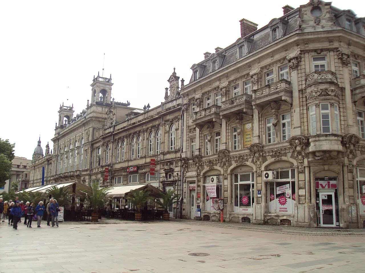Ornate nineteenth-century buildings and cafés on a central square in Ruse